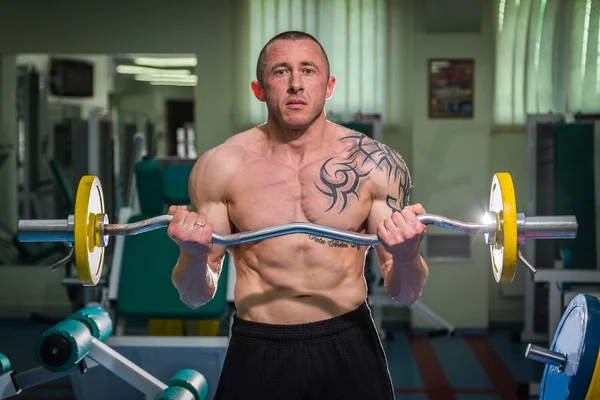 Man  with athletic barbell — Stock Photo, Image