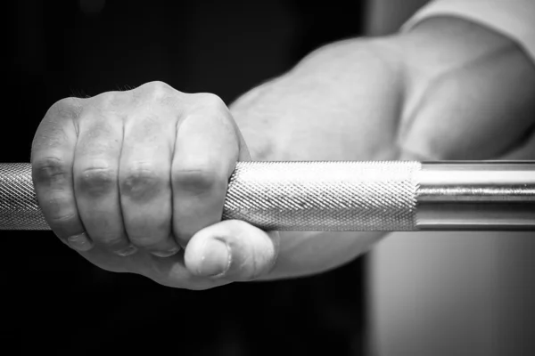 Hand holding barbell — Stock Photo, Image