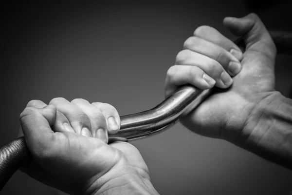 Hand holding barbell — Stock Photo, Image