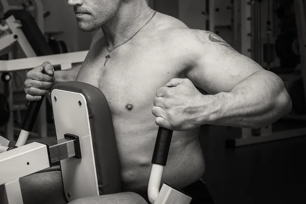 Man  in tattoo  in the gym — Stock Photo, Image