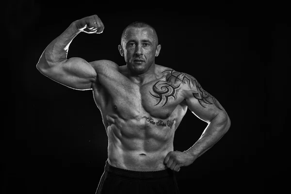 Muscle man with tattoos — Stock Photo, Image