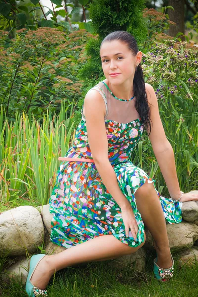 Pretty brunette in the garden — Stock Photo, Image