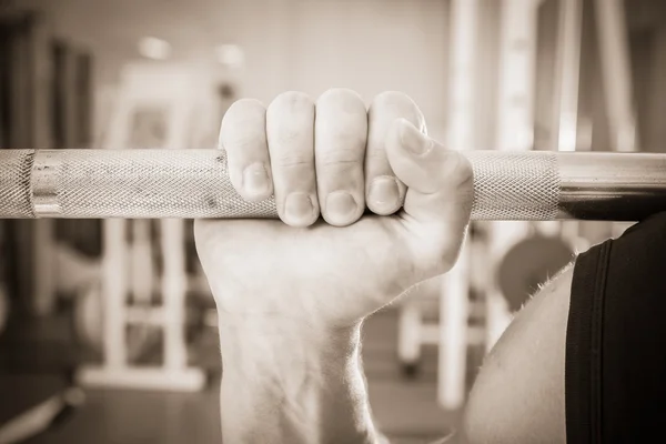 Hand holding barbell — Stock Photo, Image