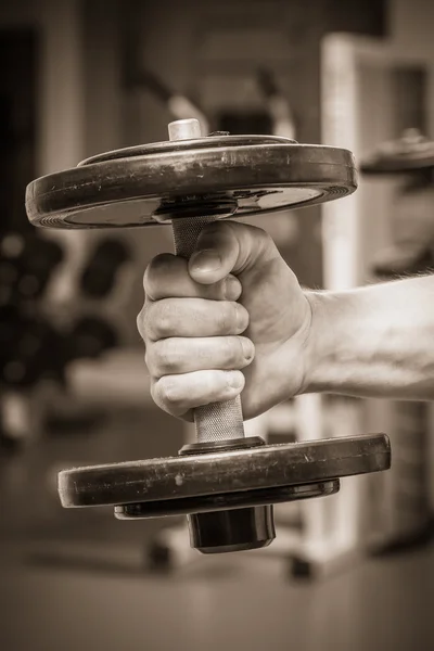 Hand holding dumbbell — Stock Photo, Image