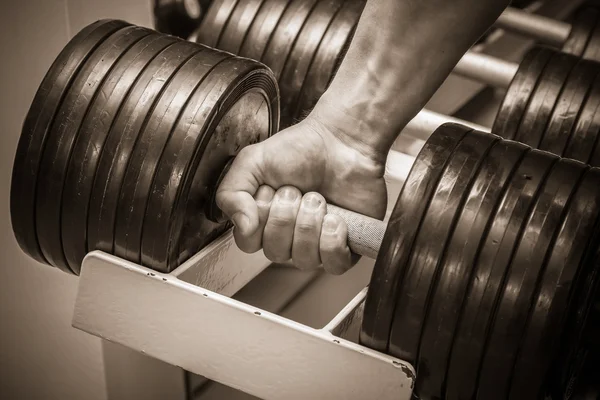 Hand holding dumbbell — Stock Photo, Image