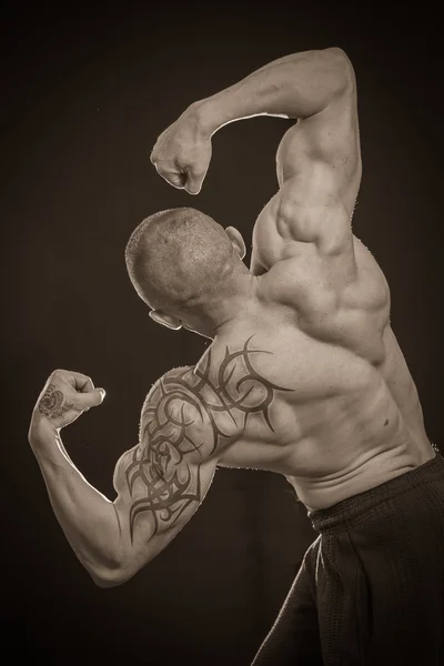 Muscle man with tattoos — Stock Photo, Image