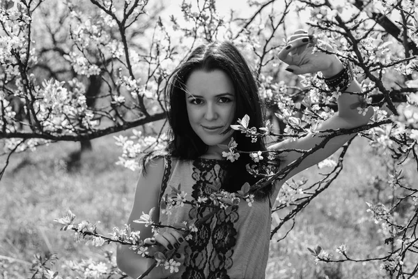 Girl near a flowering tree — Stock Photo, Image