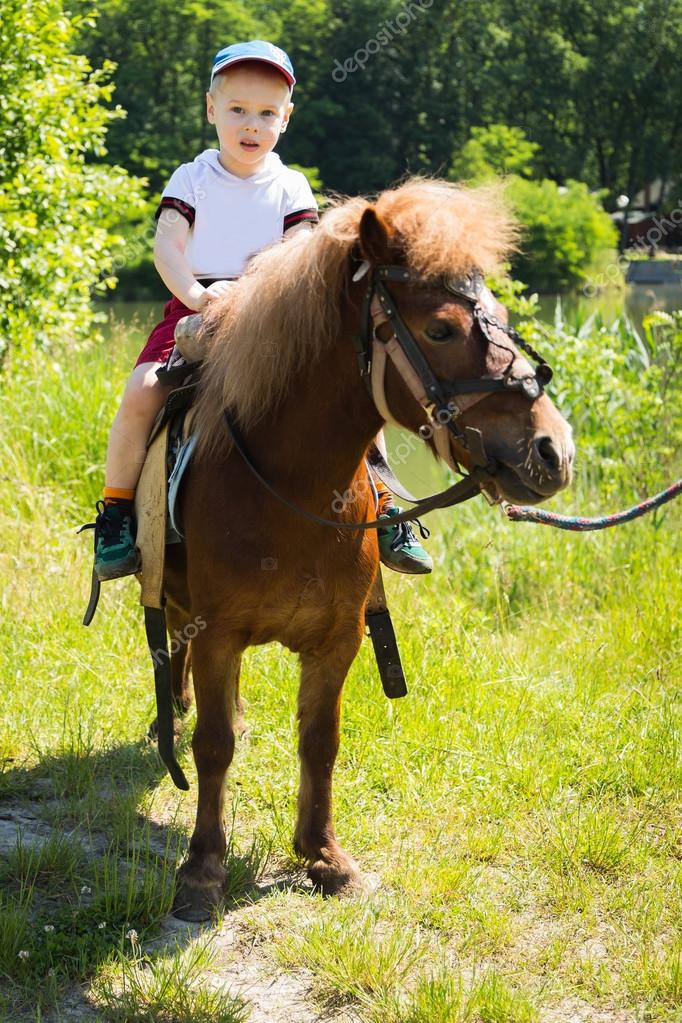 Download Boy Riding Pony Stock Photo Image By C Aallm 48420791