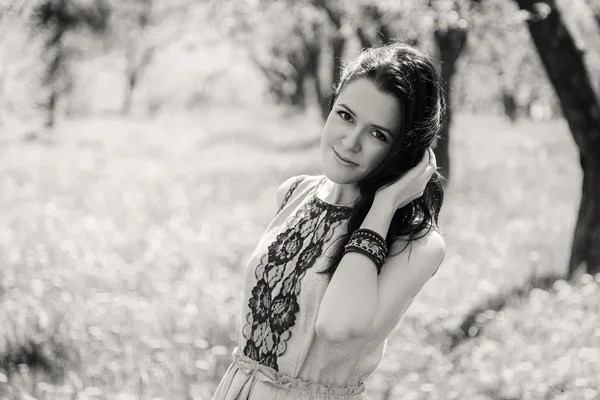 Pretty brunette in the garden — Stock Photo, Image