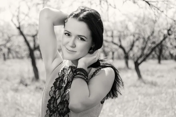 Pretty brunette in the garden — Stock Photo, Image