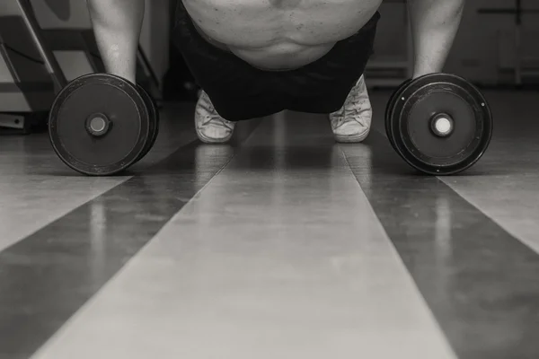 Man doing workout with heavy dumbbell — Stock Photo, Image