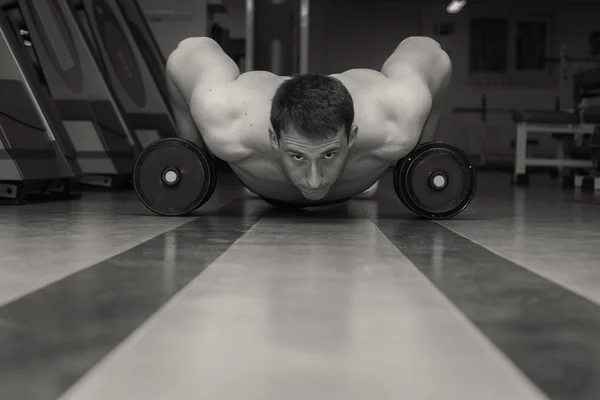 Man doing workout with heavy dumbbell — Stock Photo, Image