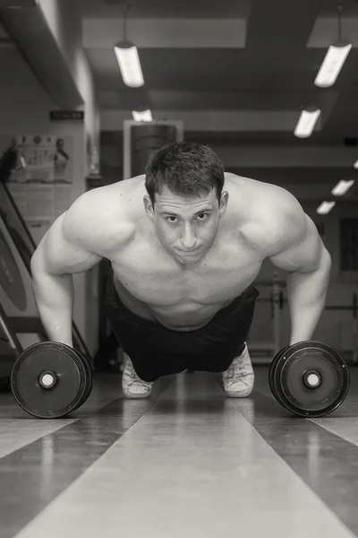 Man doing workout with heavy dumbbell — Stock Photo, Image