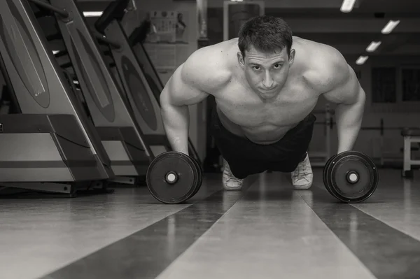 Man doing workout with heavy dumbbell — Stock Photo, Image