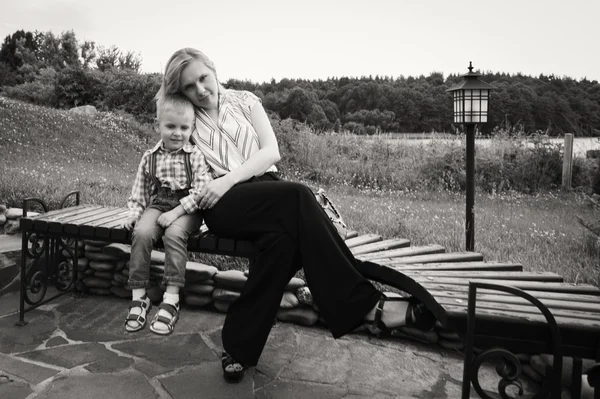 Mother with son near the source of water — Stock Photo, Image