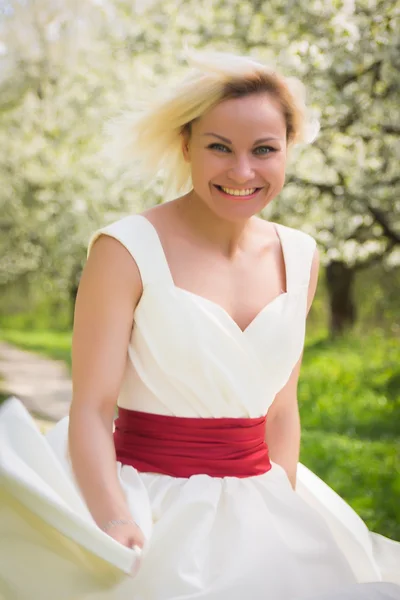 Blonde in the spring garden — Stock Photo, Image