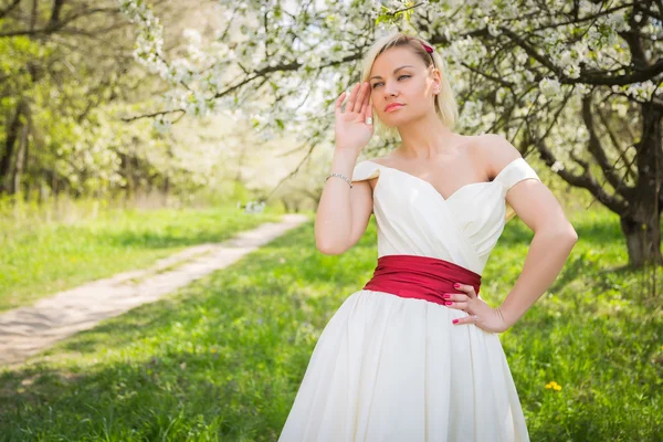 Blonde in the spring garden Royalty Free Stock Photos