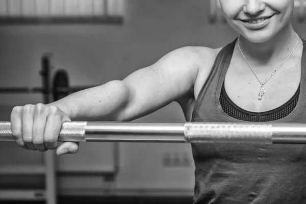 Woman with barbell — Stock Photo, Image