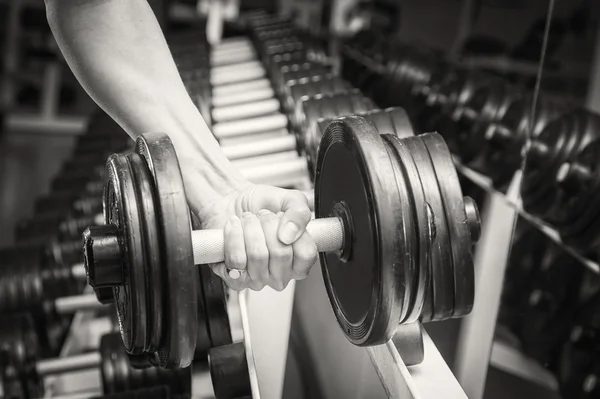 Muscular arm in the gym. — Stock Photo, Image