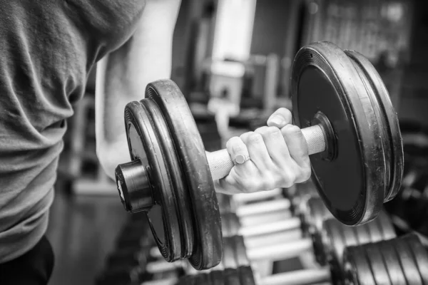 Muscular arm in the gym. — Stock Photo, Image