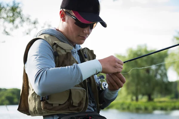 Fisherman on the river bank. — Stock Photo, Image