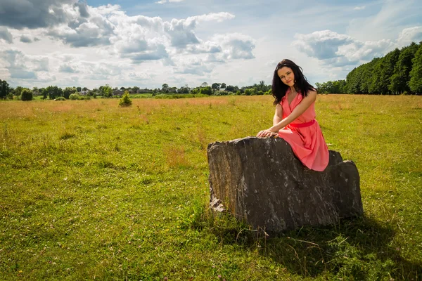Woman on stone — Stock Photo, Image