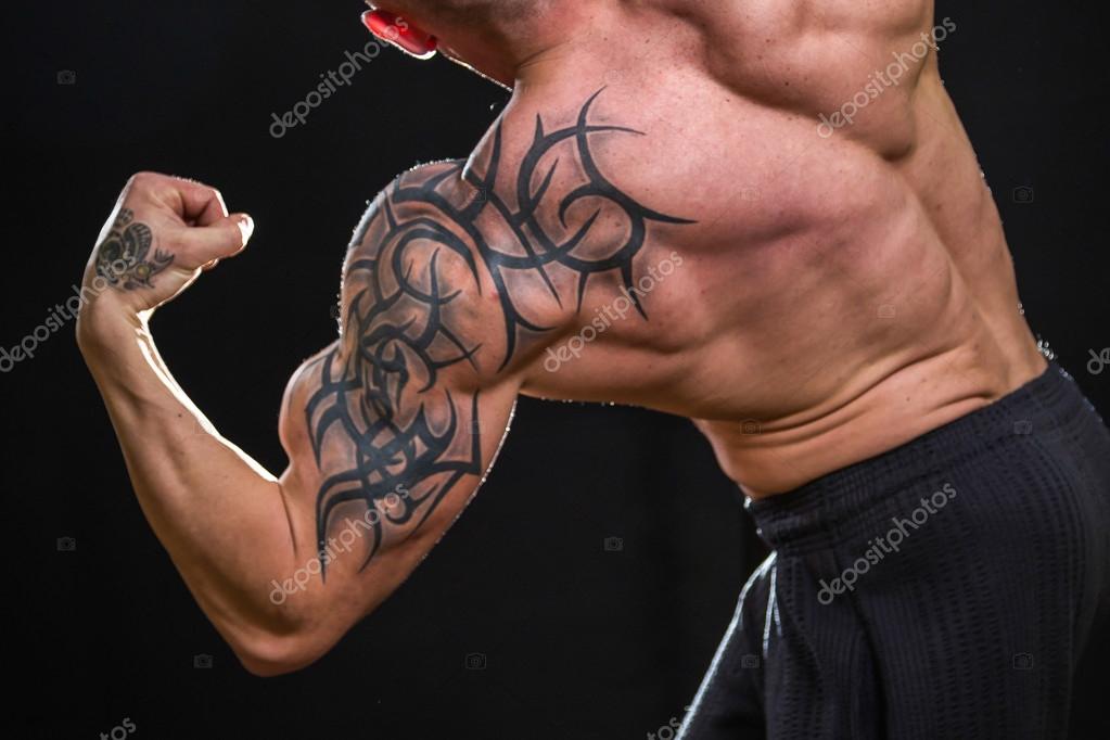 Bodybuilder with tattoos — Stock Photo © aallm #51159649