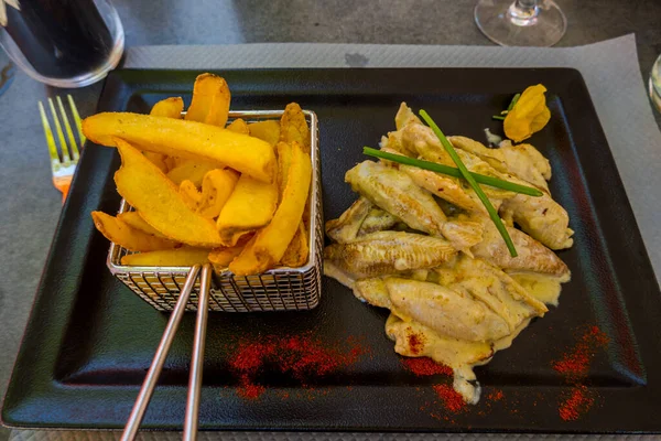 French fries with fish in a French restaurant