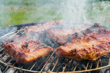 Pork ribs are fried on the grill. Delicious.Food background