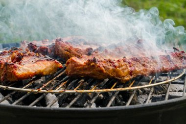Pork ribs are fried on the grill. Delicious.Food background