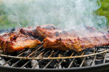 Pork ribs are fried on the grill. Delicious.Food background