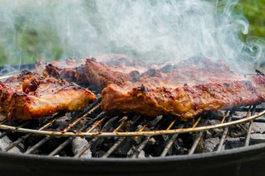 Pork ribs are fried on the grill. Delicious.Food background