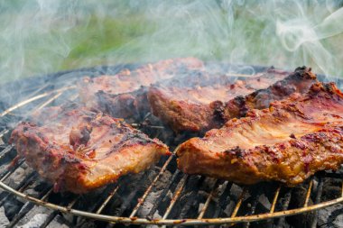 Pork ribs are fried on the grill. Delicious.Food background