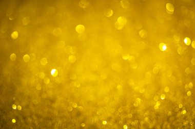 Altın sarısı arka plan. Klasik parıltılı ışıklar, parıldayan noel efektleri arka plan fotoğrafı.