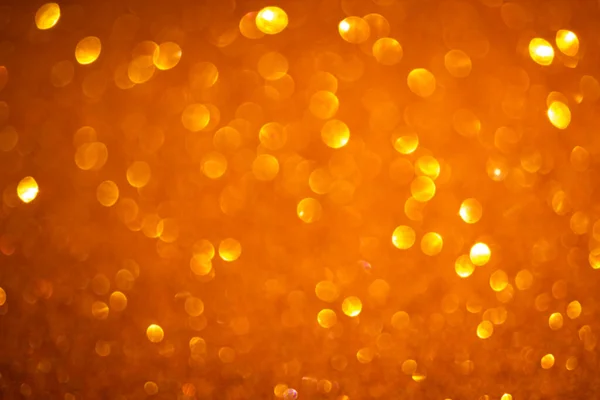 Orange bokeh bakgrund. Vintage glitter ljus, glödande jul effekter bakgrund foto — Stockfoto