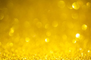 Altın bokeh arka planı. Vintage parıltılı ışıklar, parıldayan Noel efektleri arka planı 