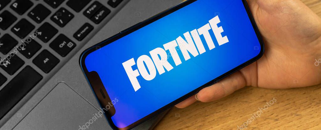 Kharkov, Ukraine - January 14, 2022: Apple iPhone with Fortnite logo, banner, closeup