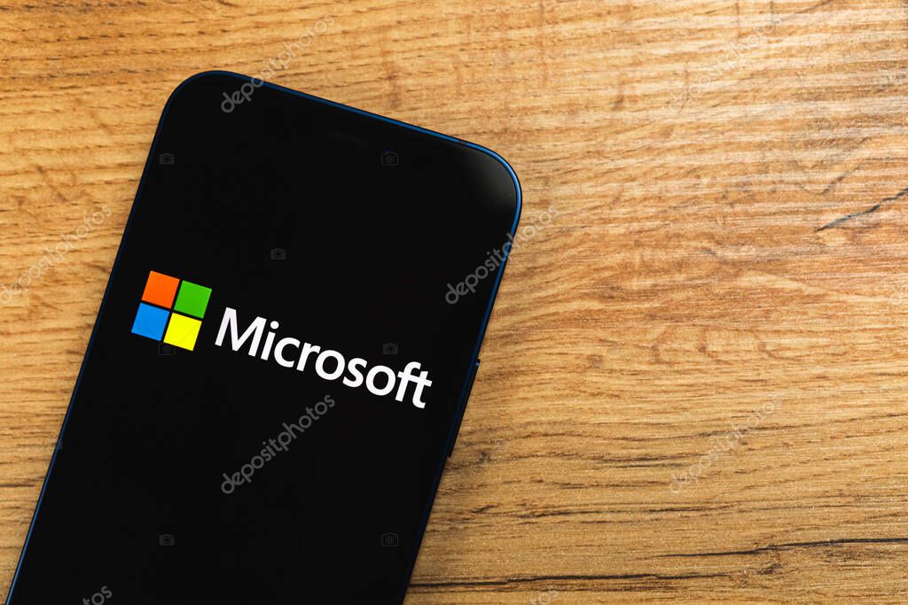 Kharkov, Ukraine - January 19, 2021: Microsoft logo close-up, wooden background, top view photo