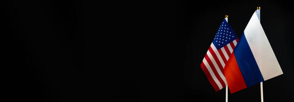USA and Russia flag banner. Conflict, diplomatic relations. The concept of sanctions pressure in politics. World crisis, war. Black background