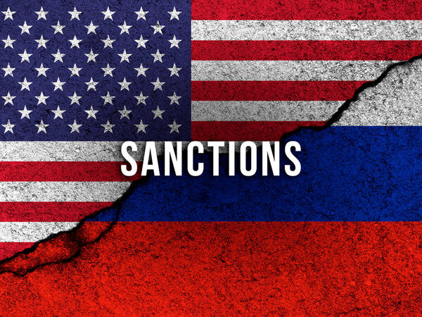 USA sanctions against Russia concept background with country flags painted on cracked concrete wall