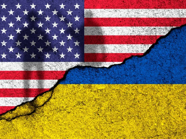 USA support for Ukraine in war. Russian invasion concept. Soldiers silhouette. United States of America and Ukraine flags on concrete wall background