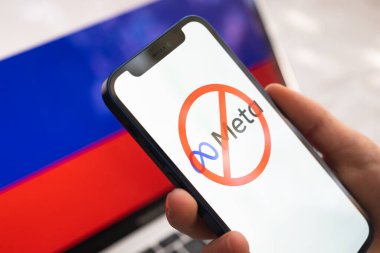 Poltava, Ukraine - March 23, 2022: Meta and Russia flag. Sanctions, ban and banned business. Meta logo, big company stopped working in Russian Federation  clipart