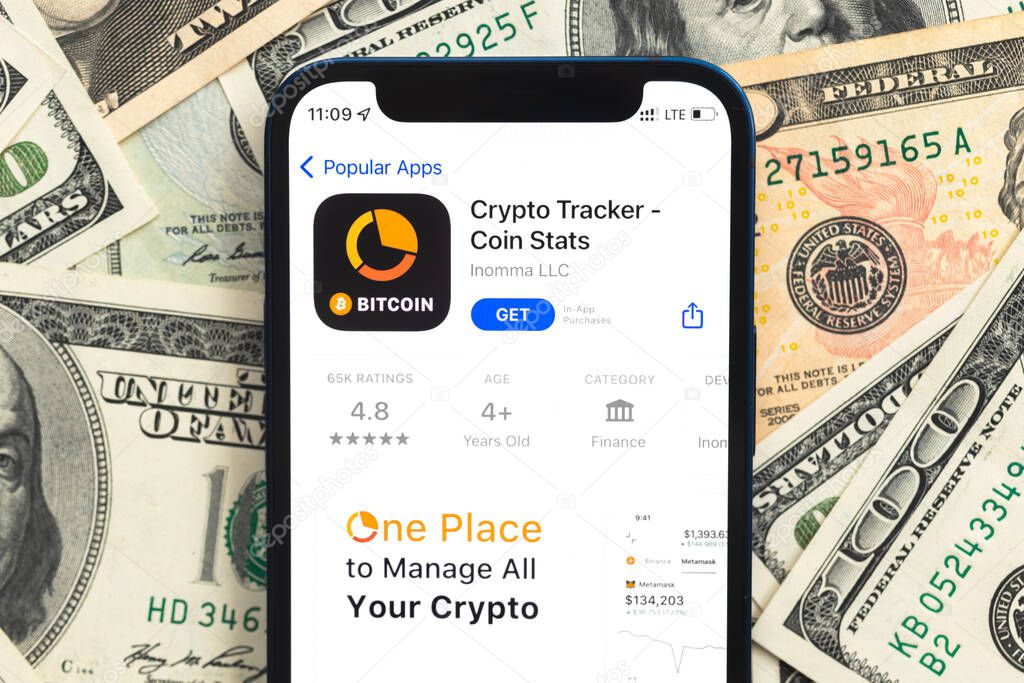 Poltava, Ukraine - April 28, 2022: Crypto Tracker app, crypto currency application for mobile phone. Business and investment concept