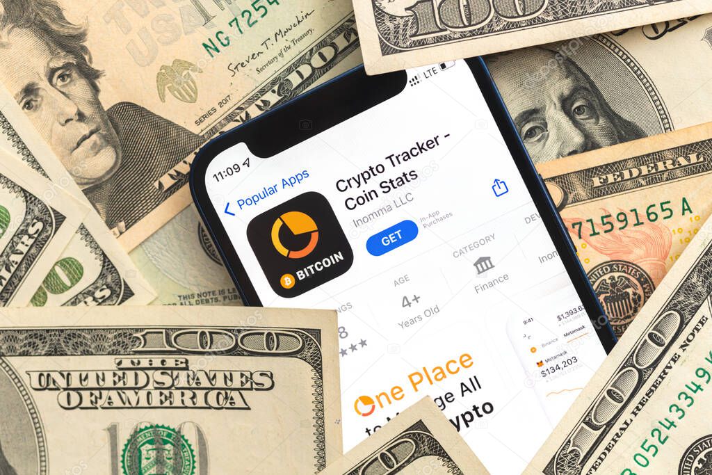Poltava, Ukraine - April 28, 2022: Crypto Tracker app, crypto currency application for mobile phone. Business and investment concept
