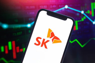Poltava, Ukraine - May 11, 2022: SK oil logo company, gas and oil prices, energy industry. Petroleum stock market graphs, global financial background. Gasoline and diesel concept photo