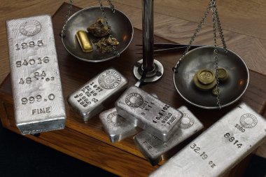 Gold and Silver Bullion on Antique Balance Scale clipart