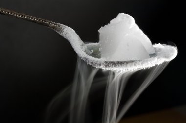 Dry Ice on Metal Spoon clipart