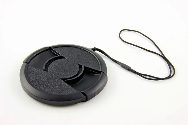Snap-on lens cap with a stripe — Stock Photo, Image
