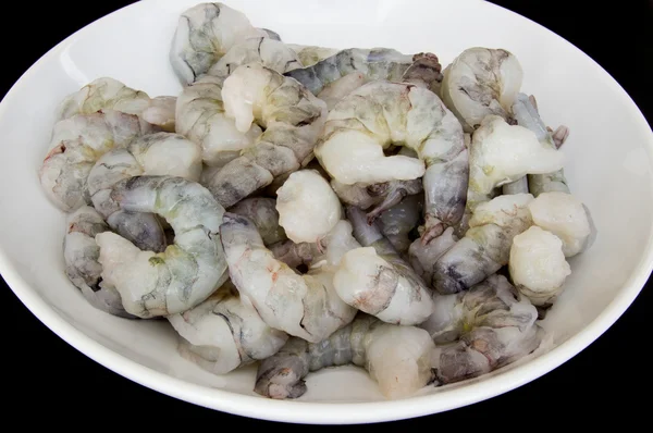 Raw shrimps on white platter — Stock Photo, Image