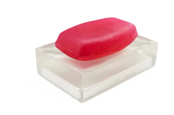 Classic red soap on a semi transparent soap dish — Stock Photo, Image